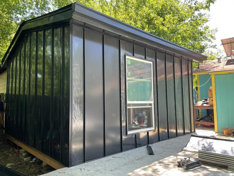 Black standing seam metal wall panels for Metal Roof Installation in Sioux Center