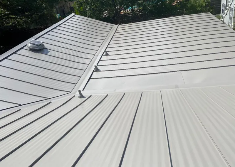 Solar attic fan installed on a metal roof for Roof Ventilation in Sioux Center